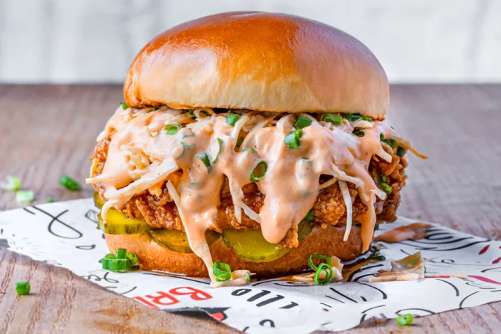 Crispy chicken sandwich with slaw on a toasted bun