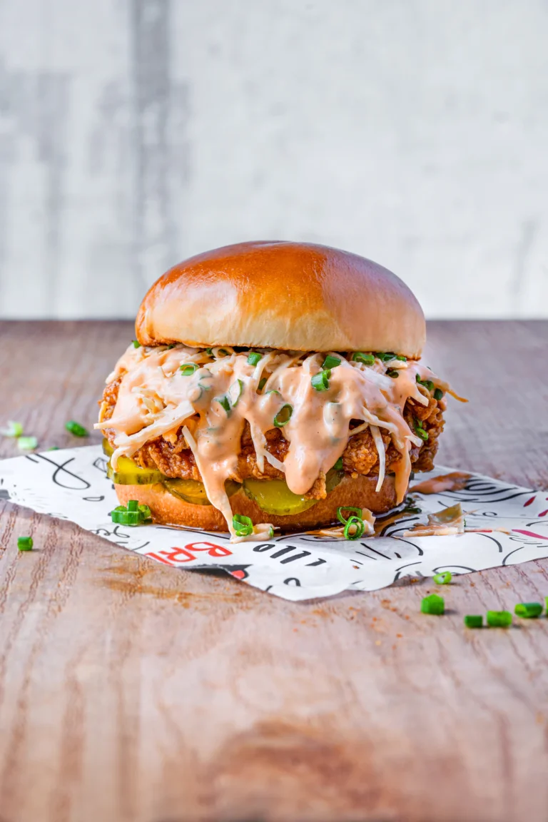 Crispy chicken sandwich with slaw on a toasted bun