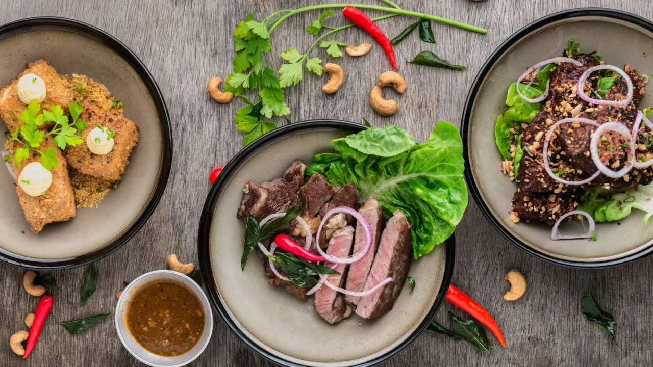 Overhead view of several plated dishes on a table