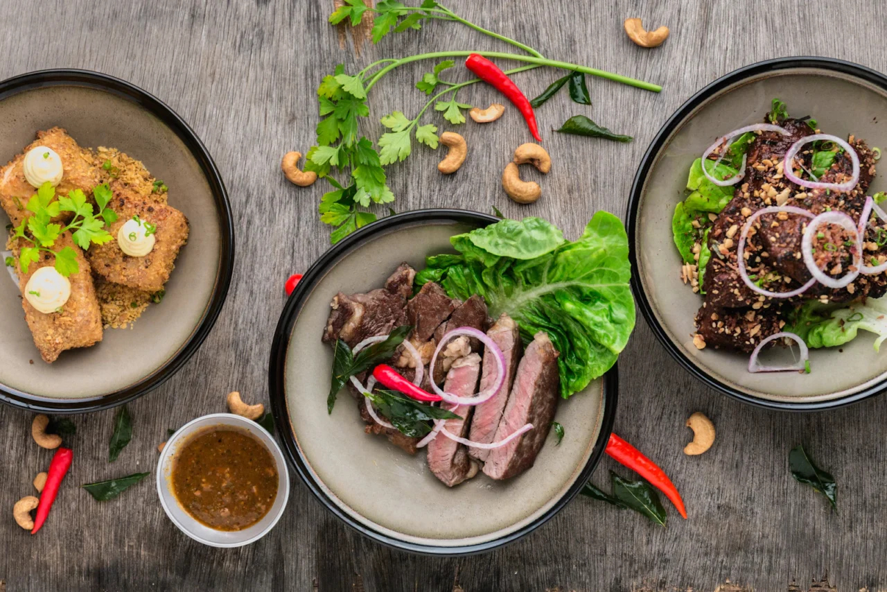 Overhead view of several plated dishes on a table