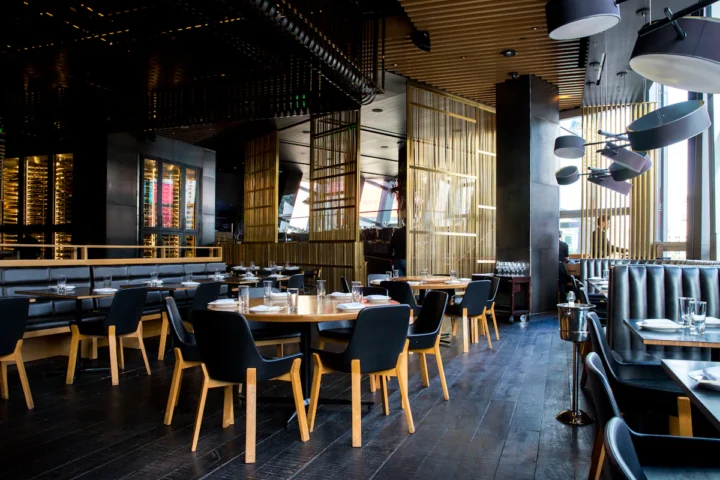 Modern restaurant dining room with tables and chairs